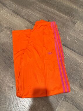 adidas Bright Orange track pants with Pink Stripes